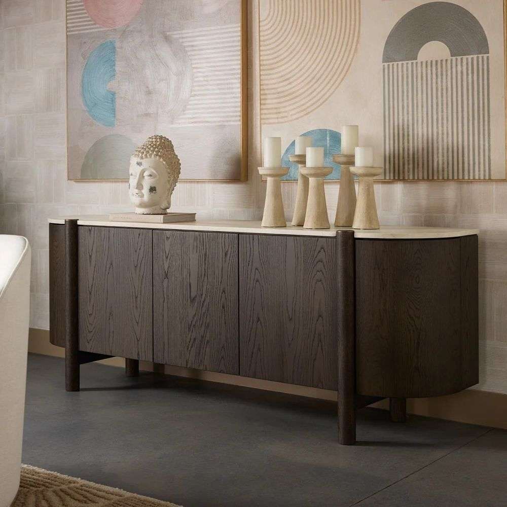 Dark wood sideboard with rounded edges, vertical wood grain detailing, and a light stone top.