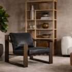 Modern lounge chair with a bold architectural wood frame in a warm brown finish, featuring a black leather seat and back cushion.