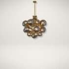 Modern chandelier with brass frame and clustered smoked glass globe shades creating a sculptural lighting fixture.