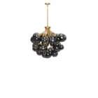 Modern chandelier with brass frame and clustered smoked glass globe shades creating a sculptural lighting fixture.