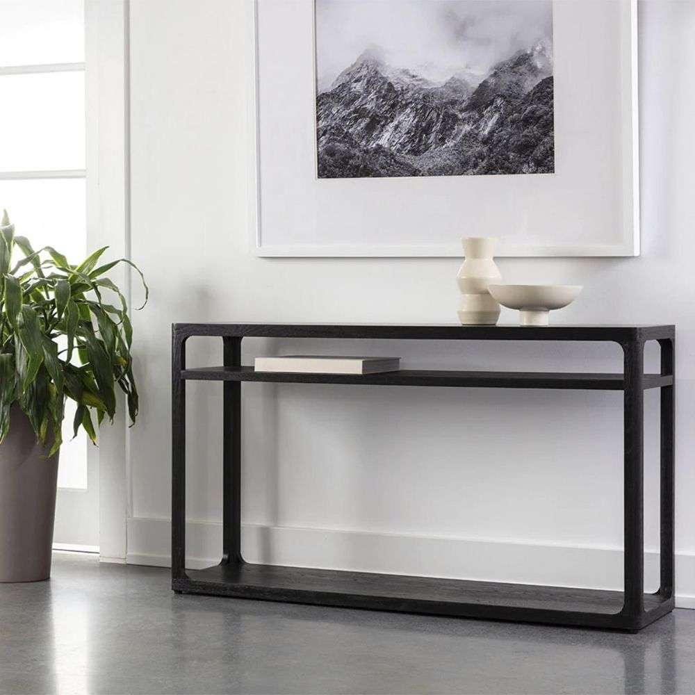 Black console table with slim frame and two open shelves in a minimalist design.
