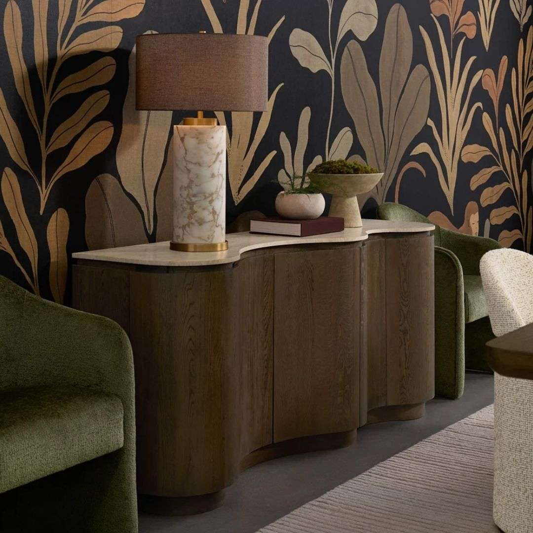 Curved wood sideboard with fluted doors and a light stone top in a warm modern design.