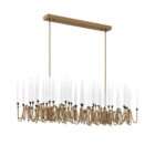 Modern linear chandelier with brass frame and multiple candle-style lights arranged in a sculptural wave pattern.