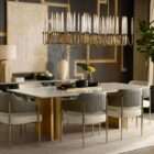 Modern linear chandelier with brass frame and multiple candle-style lights arranged in a sculptural wave pattern.