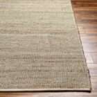 Neutral beige woven area rug with subtle tonal variation and organic texture.