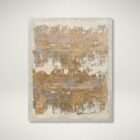 Abstract area rug with layered gold, taupe, and grey tones creating an artistic, textured pattern.