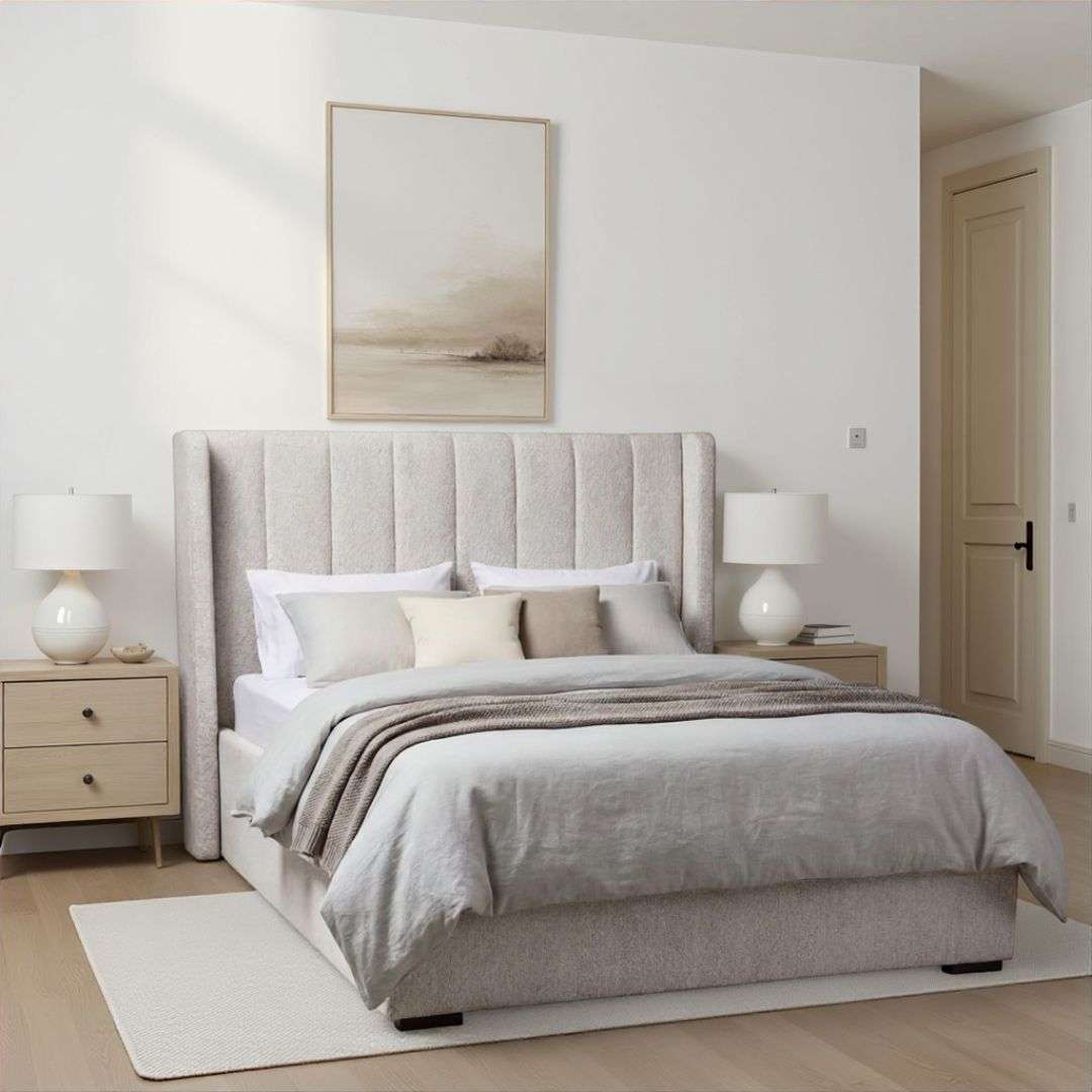 Upholstered bed with a tall vertical channel-tufted headboard, soft textured fabric, and a low-profile frame.