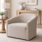 Curved upholstered accent chair in light grey fabric with a low-profile silhouette and rounded back.