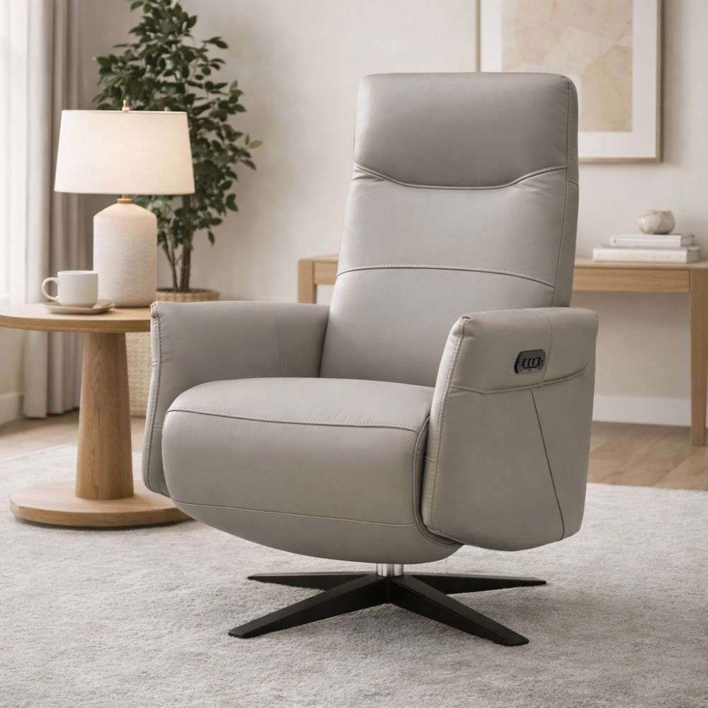 Light grey leather power recliner chair with padded arms, high back, and black swivel base.
