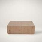 Low-profile square wood coffee table with a minimalist block design in a light natural finish.