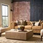 Low-profile square wood coffee table with a minimalist block design in a light natural finish.