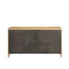 Light wood dresser with six drawers featuring vertical fluted detailing and round metal knobs.