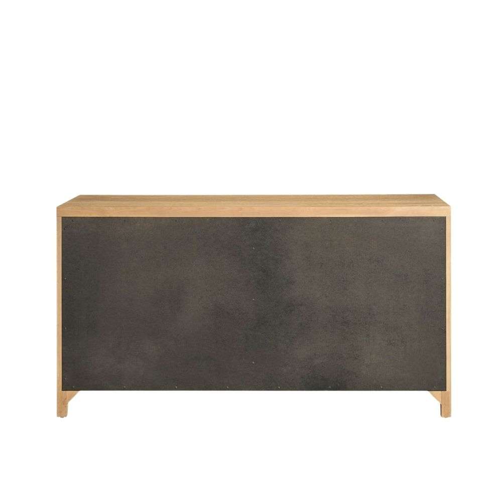 Light wood dresser with six drawers featuring vertical fluted detailing and round metal knobs.