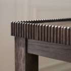 Long wooden console table with a lower shelf, curved legs, and detailed edge trim in a warm medium wood finish.