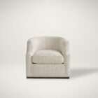 Swivel accent chair upholstered in a soft textured cream fabric with a curved back and concealed base. Upholstered in a warm neutral fabric, this chair brings a sense of ease and versatility, while the solid wood frame adds structure and richness. The angled legs introduce a touch of mid-century influence, giving it a refined yet relaxed presence. Ideal for dining spaces or as an occasional chair, the Clarity delivers both function and elevated style.