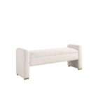 Upholstered bench in a soft textured cream fabric with curved arms on each end and a clean, tailored silhouette.