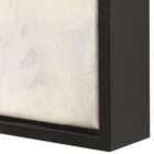 Abstract wall art featuring layered neutral tones with textured beige, cream, and warm brown forms in a black frame.