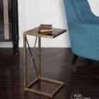 Uttermost Zafina accent table with antique brass metal frame, black glass top, and geometric cross base