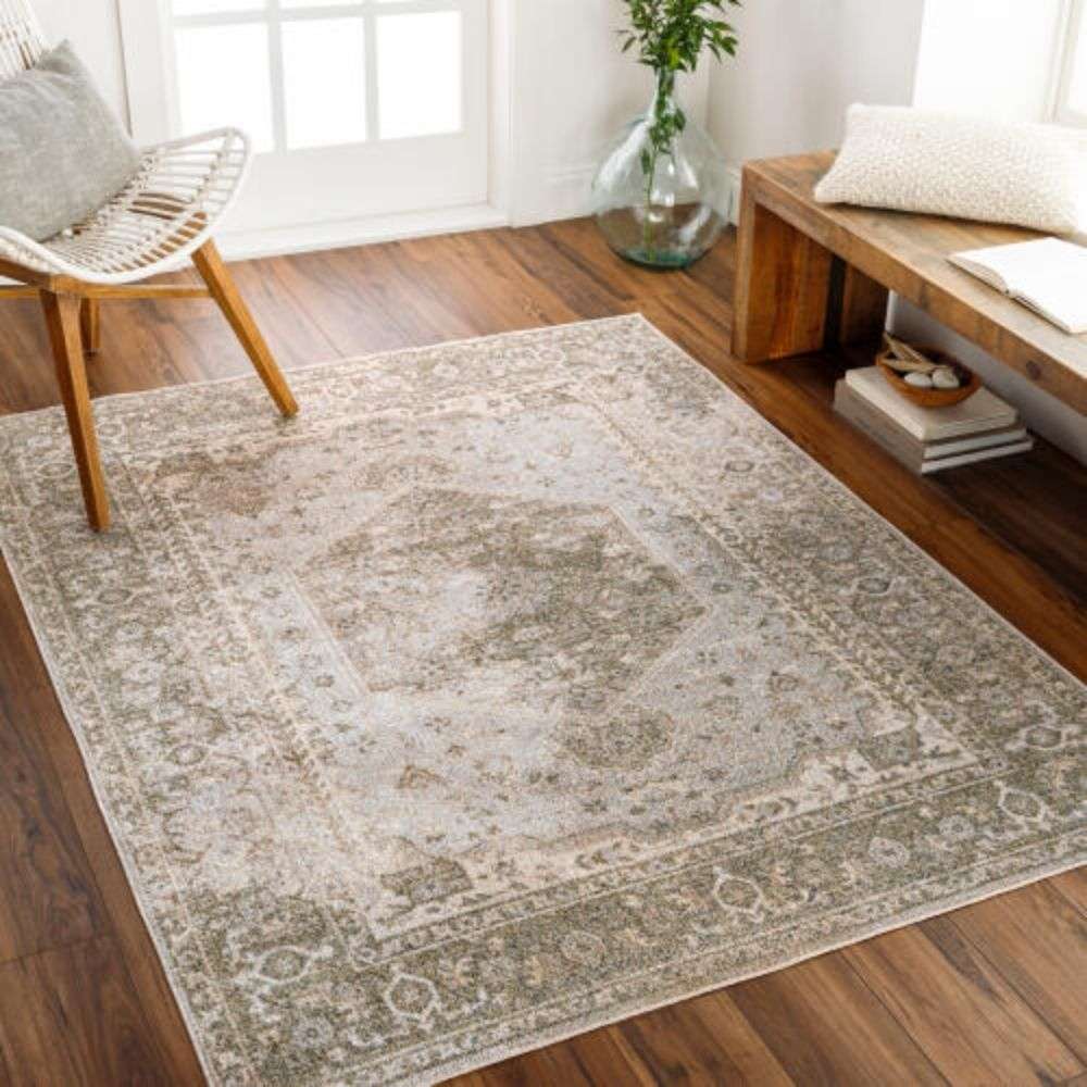 Surya Lillian area rug with vintage-inspired medallion pattern in warm beige, taupe, and soft grey tones
