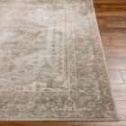 Surya Lillian area rug with vintage-inspired medallion pattern in warm beige, taupe, and soft grey tones