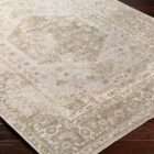 Surya Lillian area rug with vintage-inspired medallion pattern in warm beige, taupe, and soft grey tones