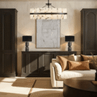 Pair of black marble table lamps styled on dark cabinetry in an elegant neutral living room.